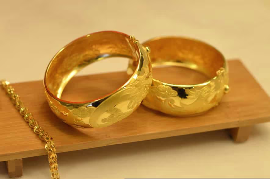 Gold jewellery displayed in a showroom as investors and consumers track falling gold prices across India.
